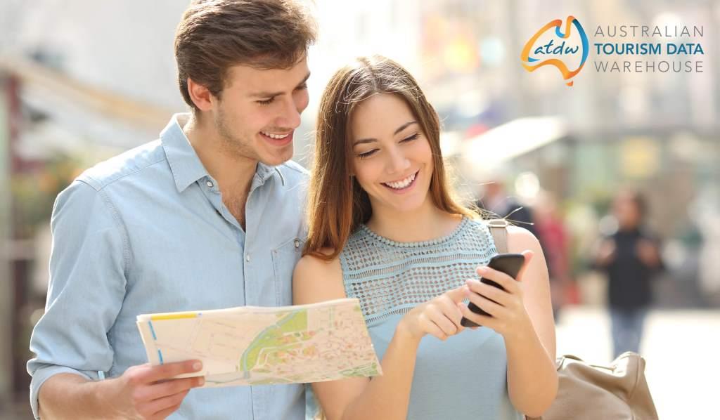 ATDW couple using map and phone